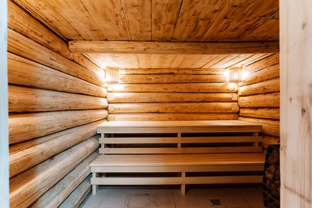 peaceful sauna environment, serene sauna space featuring cozy wooden benches and subtle lighting, relaxing sauna scene showcasing tranquil wooden benches and gentle illumination to evokeの写真素材