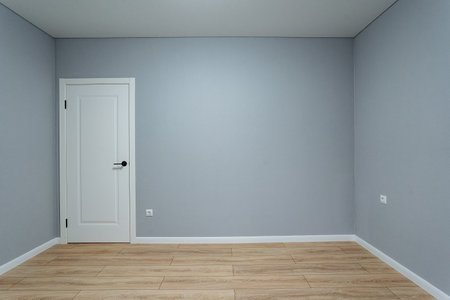 blank room prepared for personalized styling, neutral interior space awaiting customized furnishings and decor, spacious and neutral gray room designed for various creative interiorの写真素材