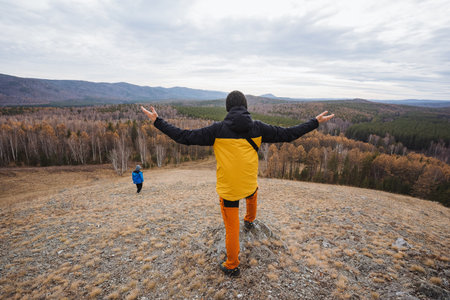 Participants enjoy colorful seasonal festivities, Group celebrates outdoors amidst vibrant fall...