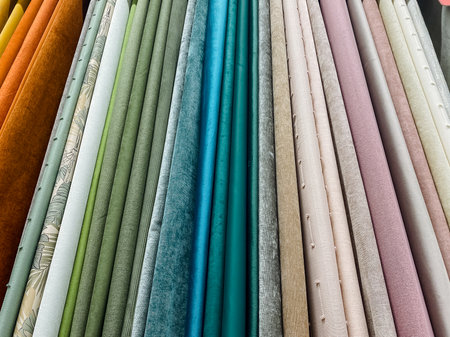 Fabric display overview, Arrangement of assorted fabrics in vibrant pastel and teal shades, Organized collection of fabric samples highlighting color variation and texture for designの写真素材