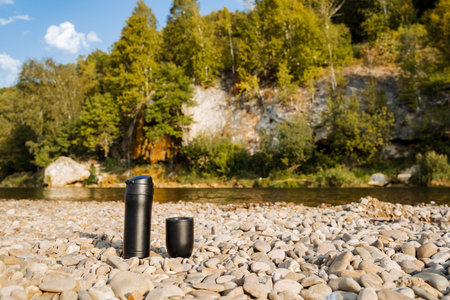 scenic summer landscape, stunning lakeside view with cliffs, vivid river scene showcasing towering rock formations, charming natural scenery featuring shimmering waters and rugged cliffsの写真素材