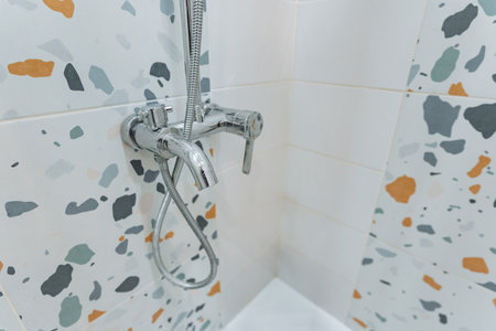 vibrant terrazzo corner design, modern playful bathroom with durable surface, contemporary bathroom corner showcasing terrazzo tiles with vivid colors and resilient easyclean finishの写真素材