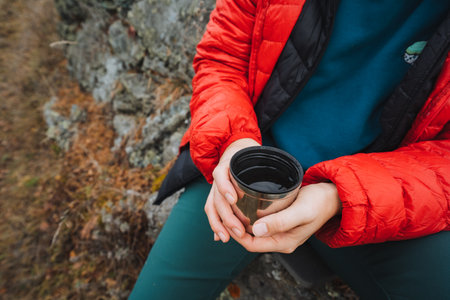 Hikers and skiers find peaceful respite in majestic mountain landscapes at rest, Tranquil outdoor enthusiasts pause their activities to admire scenic vistas and breathe fresh mountain airの写真素材