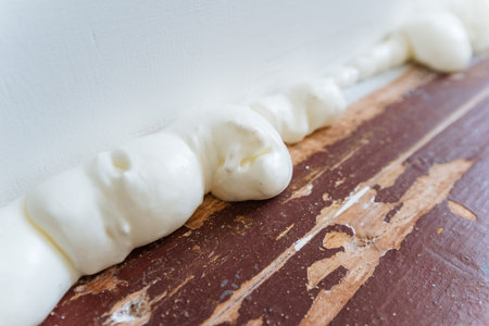 Inspection Of Surface, Snapshot Capturing Detailed View Of Curing And Textured Foam Surface, Highdetail Image Showing Contractor Inspecting Bead Adhesion On Freshly Applied Foam Surfaceの写真素材