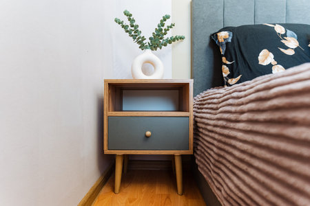 Comfortable Room Decor, Textured Bed With Warm Accents, Inviting Bedroom Setup With Soft Accessories And Details, Cozy Interior Featuring Ribbed Blankets And Ceramic Decorations For Warmthの写真素材