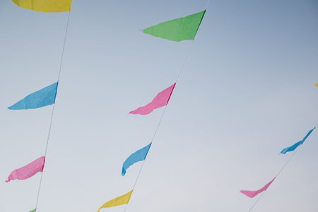Bright Flags Sway In Wind. Decorative Flags And Tassels Ripple Actively In Breezy Summer Atmosphere....