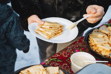 Multiple Hands Collecting Plates Of Crepes At Communal Table, Shared Celebration Vibe, Layered...
