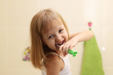 little girl clean teethの写真素材