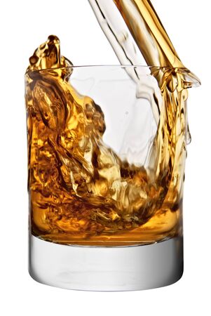 whiskey being poured into a glassの写真素材