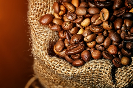 coffee beans in burlap bagの写真素材