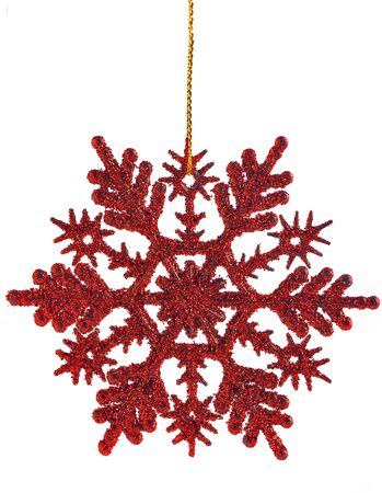 Red shiny snowflake on an isolated backgroundの写真素材