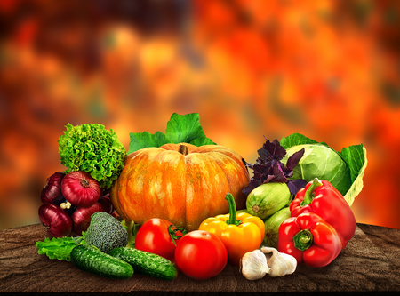 Autumn nature concept. Fall fruit and vegetables on wood. Thanksgiving dinnerの写真素材