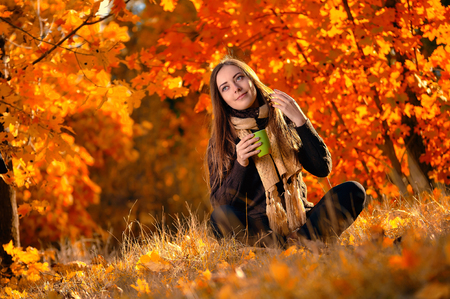 autumn woman on leafsの写真素材