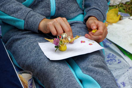 Baby handicraft made of plasticine and leavesの写真素材