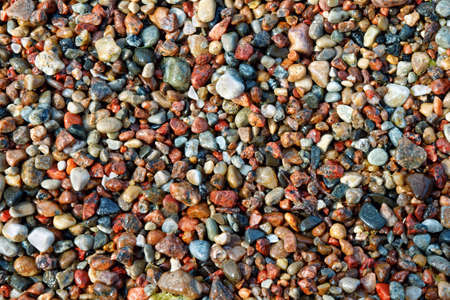 Lots of small colorful pebbles from the seashoreの写真素材