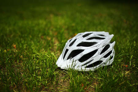 Bicycle helmet and cycle gloves isolated on white backgroundの写真素材