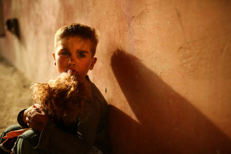 alone sad child playing on a streetの写真素材