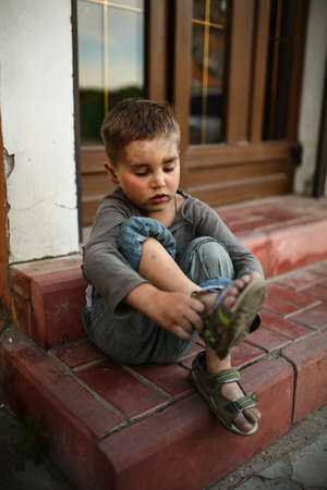alone sad child playing on a streetの写真素材
