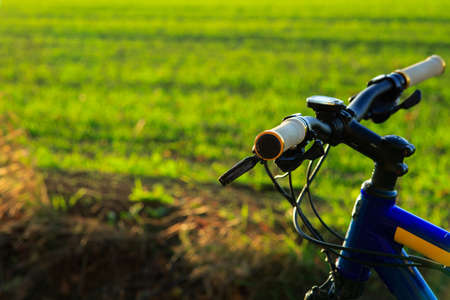 Beautiful close up scene of bicycle at sunset, silhouette of bike forward to sun, wonderful rural scene,の写真素材