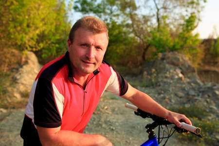 Cyclist Riding the Bike on the Beautiful Autumn Sceneの写真素材