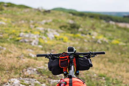 Mountain Bicycle outdoor with orange bags for travel