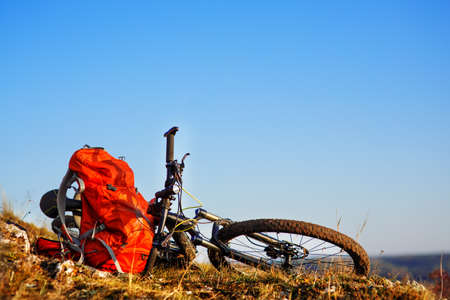 Mountain bike after ride in nature with backpack.の写真素材