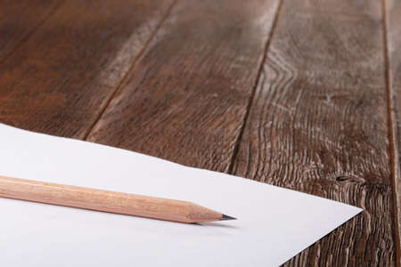 Wooden Desk Table, White Clipboard with Blank Paper. Copy space for text or Imageの写真素材