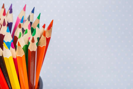 different pencils on the light in point backgroundの写真素材