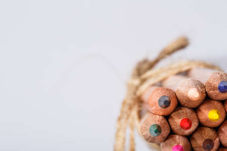 bunch of pencils stylized decirative rope on white background. Colorful pencils. Creative idea and concept. Art and design. School and education. Painting and drawing.の写真素材