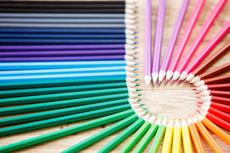 Close up stack colour pencils on wooden backgroundの写真素材