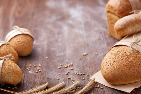 Bread loaf rustic selection of rye, soda, bloomer breads, with granary and oated rolls and ears of...
