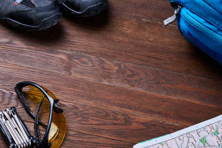Top view of the set of equipment for travelling on brown wooden boards.の写真素材