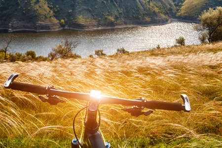 Close-up of detail of the mountain bicycle on the green grass.の写真素材