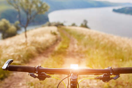 Close-up of detail of the mountain bicycle on the green grass.の写真素材