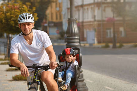 Active family riding bikes in the park summer dayの写真素材