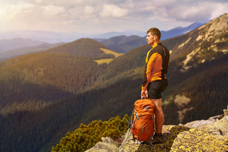 Male traveler from back in the mountains
