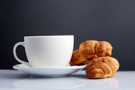 white cup of tea with cookies on a wooden background white cup of tea with cookies on a wooden background. With copy space.の写真素材