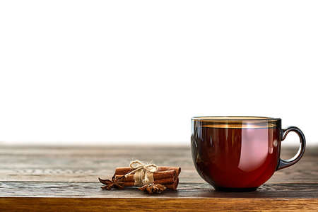 Shallow depth of field photo of empty porcelain cup with with cinnamom and fruits of star anise.の写真素材