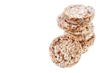 Round wheat crispbread, white background. Composition of crispbread on white background.