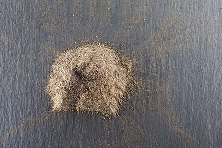 Pile of roughly milled black pepper spice.Top view.の写真素材