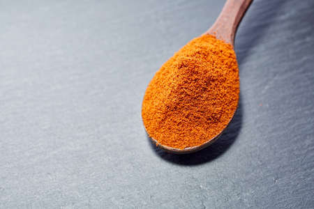 Shichimi pepper in Wooden spoon on black plate,の素材 [FY31095824213]