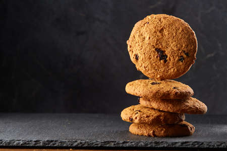 Chocolate chips cookies isolated on black background, macro, close-up