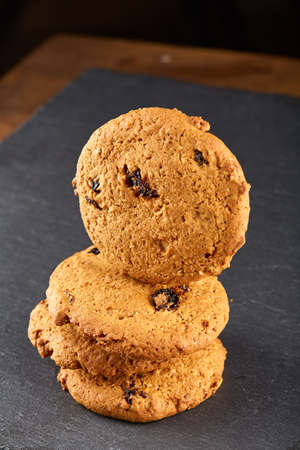 Chocolate chips cookies isolated on black background, macro, close-up