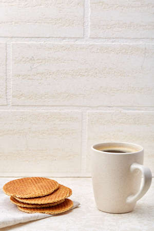 Cup of coffee and biscuit isolated on the white background, close-up, shallow depth of fieldの写真素材