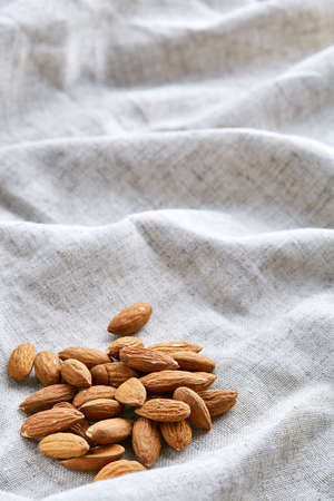 Close-up shallow depth of field picture of peanut shells food background, macro. Many peanuts in shells, one upon the other. Organic healthy nutritious tasry snack. Helthy lifestile concept.の写真素材