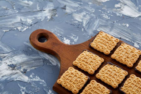 Top view close-up picture of tasty cookies on the cutting board, shallow depth of field, selective focusの写真素材