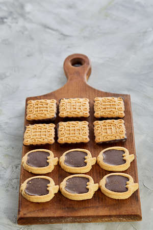 Top view close-up picture of different tasty cookies on the cutting board, shallow depth of field, selective focusの写真素材