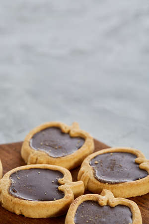 Top view close-up picture of tasty apple shaped cookies on the cutting board, shallow depth of field, selective focusの写真素材