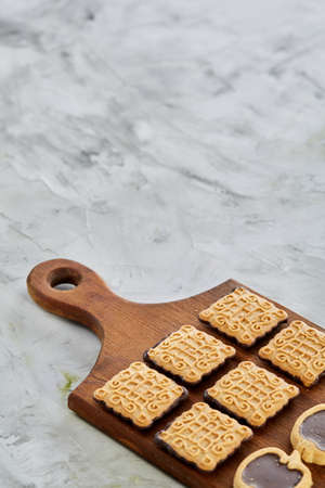 Top view close-up picture of tasty cookies on the cutting board, shallow depth of field, selective focusの写真素材