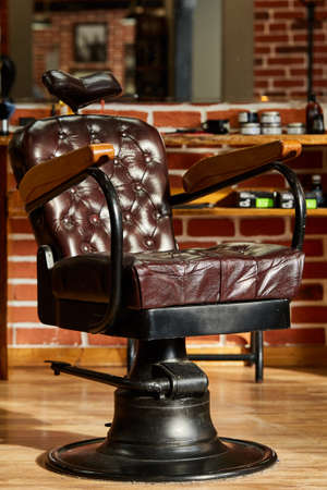 Retro leather chair barber shop in vintage style. Barbershop theme.の写真素材